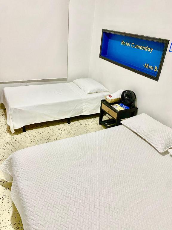 Postel nebo postele na pokoji v ubytování HOTEL CUMANDAY