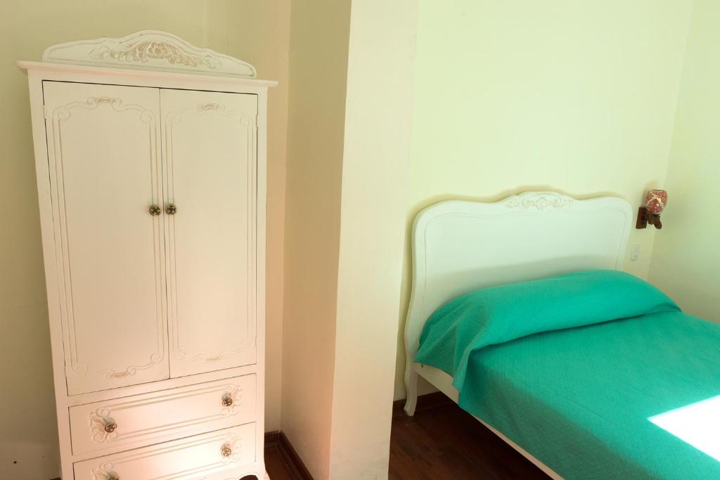 Postel nebo postele na pokoji v ubytování Hostal Casa Aborigen