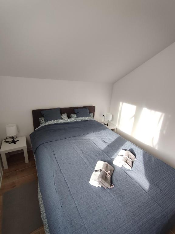 Postel nebo postele na pokoji v ubytování DIVNEST apartman