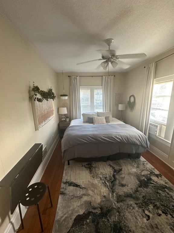 a bedroom with a bed and a ceiling fan at Beautiful Private Room With King Size Bed in Downtown Orlando in Orlando