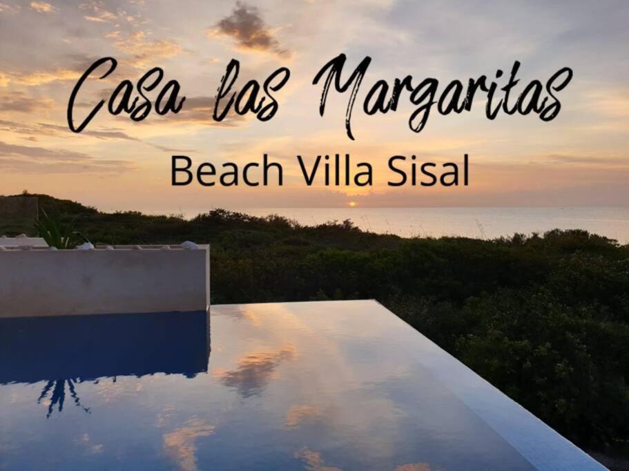 a view of a pool with the words casa las marinas beach villa at Casa las Margaritas: Beach house in a secluded Pueblo Mágico in Sisal