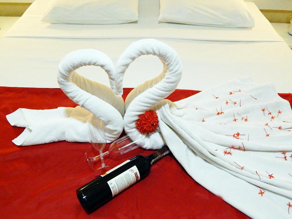 Cama ou camas em um quarto em Pousada Pérola Dourada