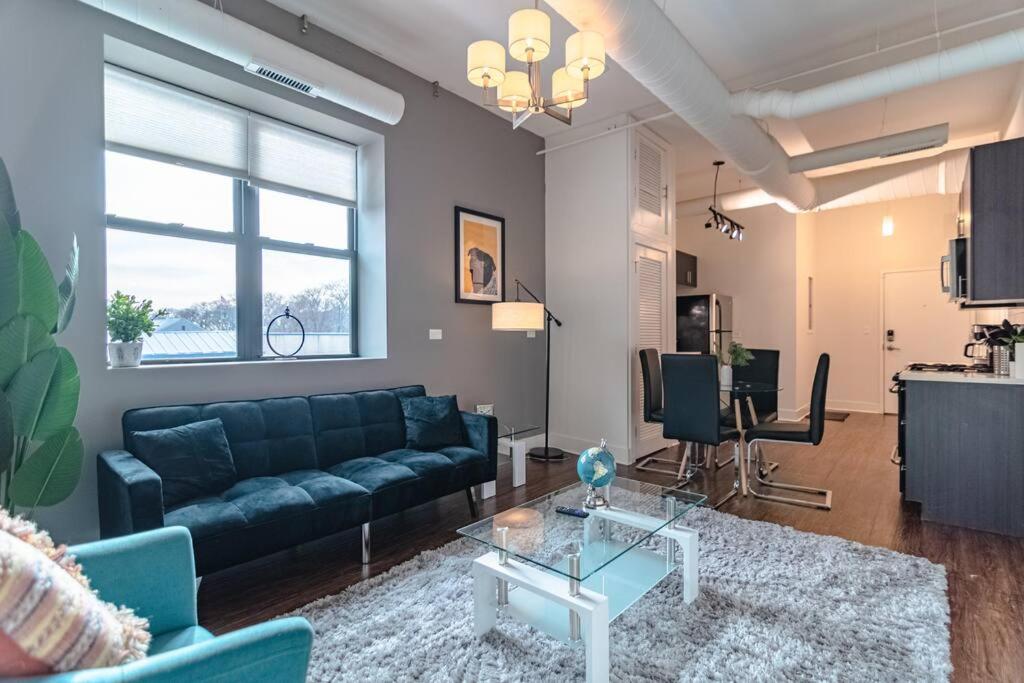 a living room with a couch and a table at McCormick Place 420 friendly 3Br Family Unit for up to 8 guests with optional parking in Chicago