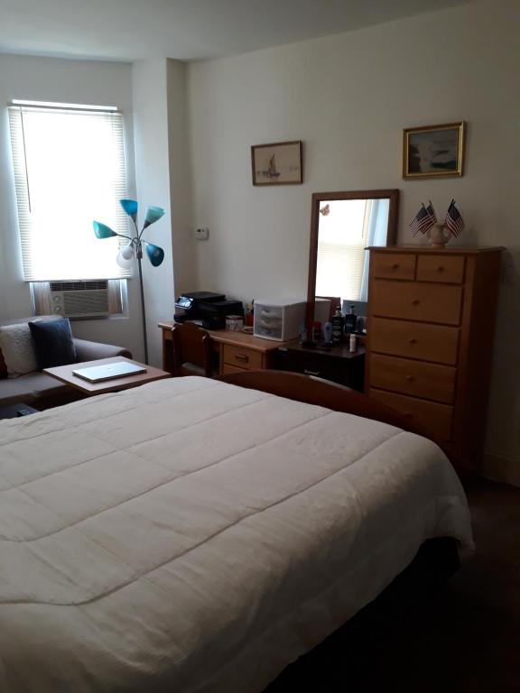 Postel nebo postele na pokoji v ubytování Pleasant Rooming House