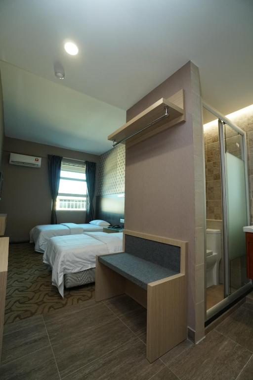 Postel nebo postele na pokoji v ubytování Regent Hotel