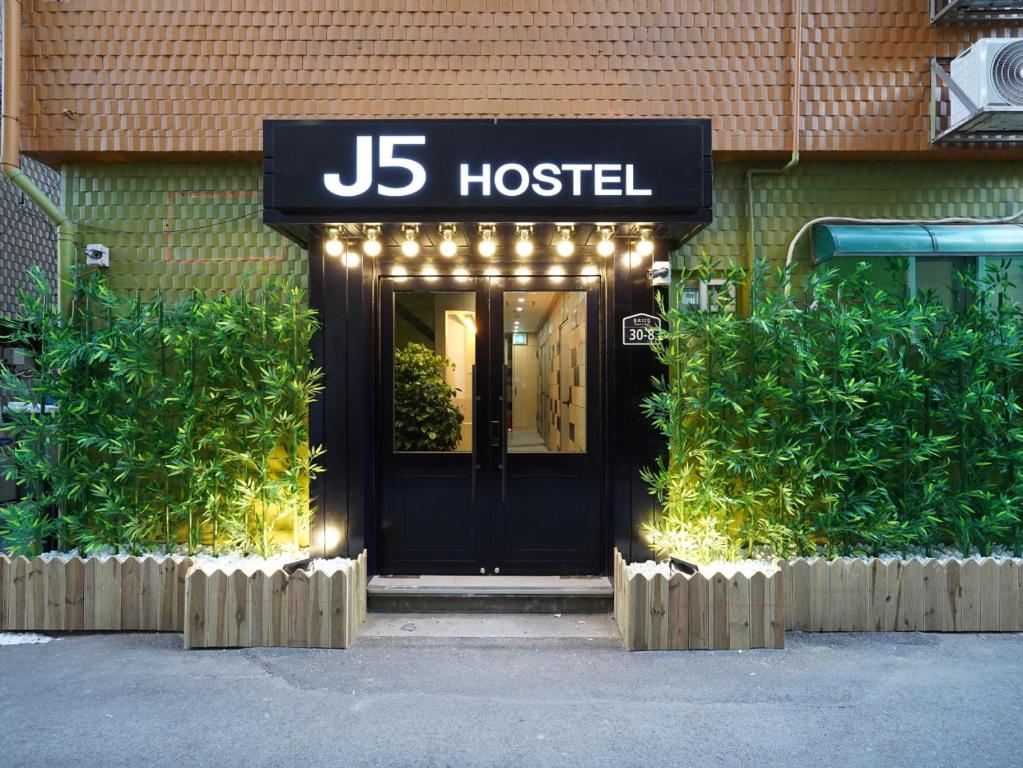 a jbs hostel front door with lights on it at J5 Hostel in Seoul