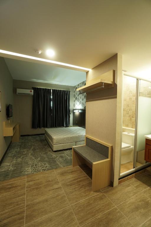 Postel nebo postele na pokoji v ubytování Regent Hotel