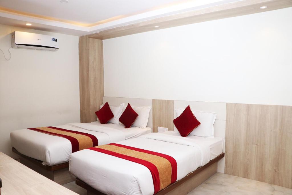Postel nebo postele na pokoji v ubytování Hotel Prime Suite
