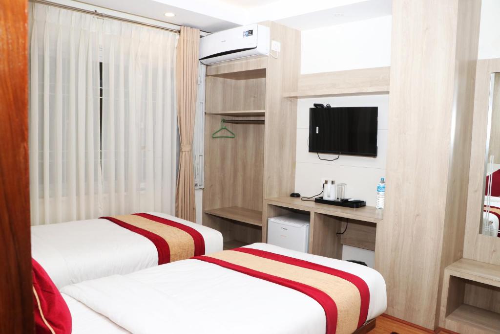 TV a/nebo společenská místnost v ubytování Hotel Prime Suite