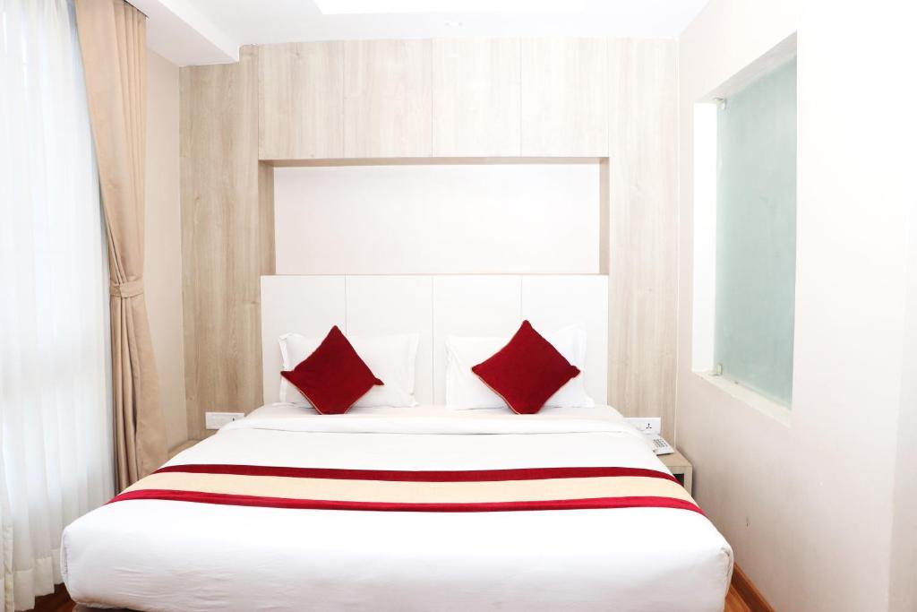 Postel nebo postele na pokoji v ubytování Hotel Prime Suite