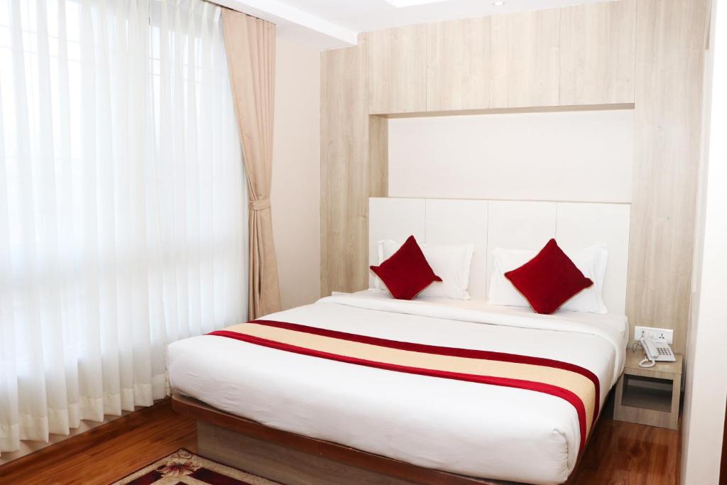 Postel nebo postele na pokoji v ubytování Hotel Prime Suite