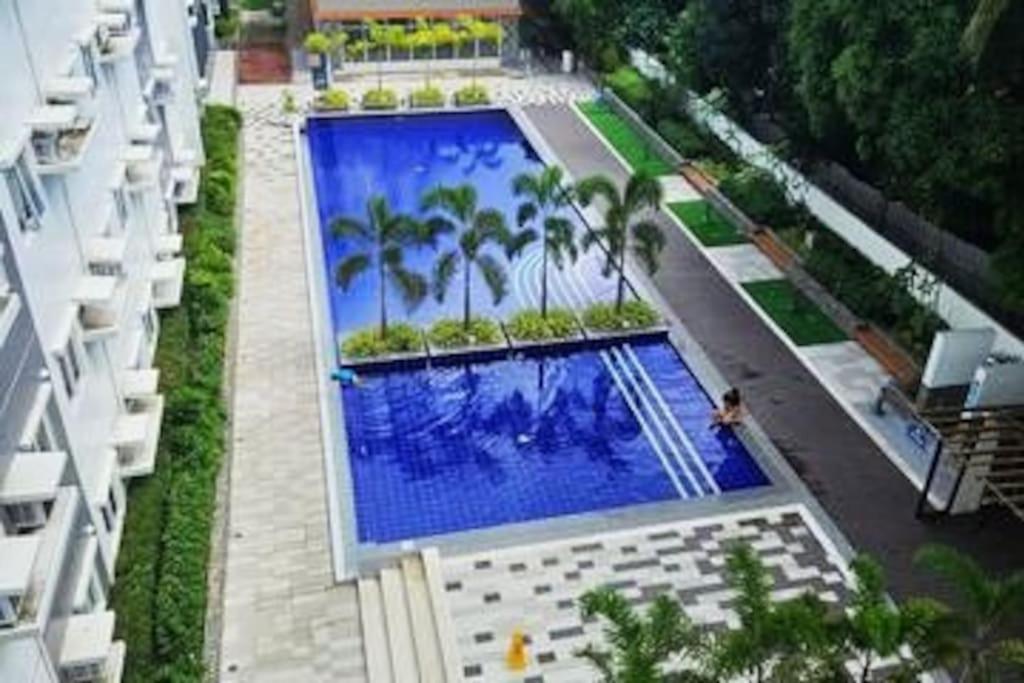 an overhead view of a swimming pool in a building at E Staycation Studio in Cebu City