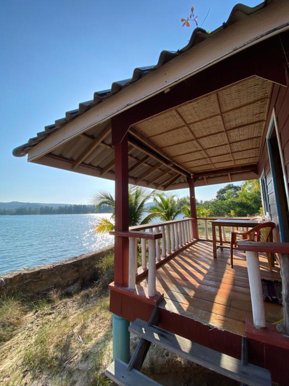 a porch of a house with a view of the water at Sok Sabay in Koh Rong Island