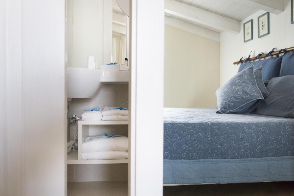 Postel nebo postele na pokoji v ubytování Residenza dei Suoni