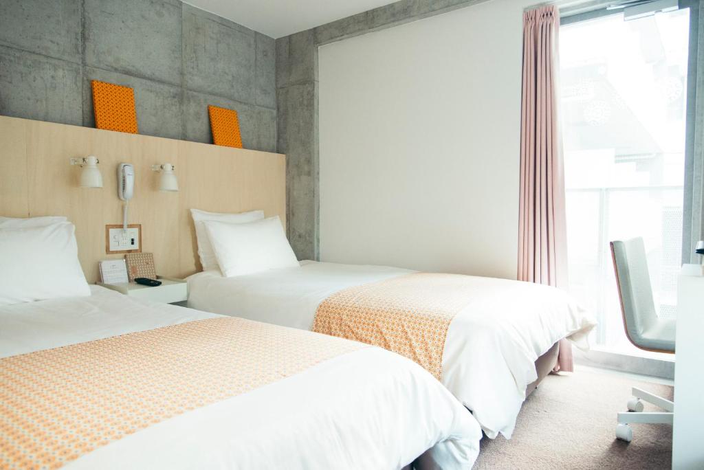 Postel nebo postele na pokoji v ubytování DOMO Hotel