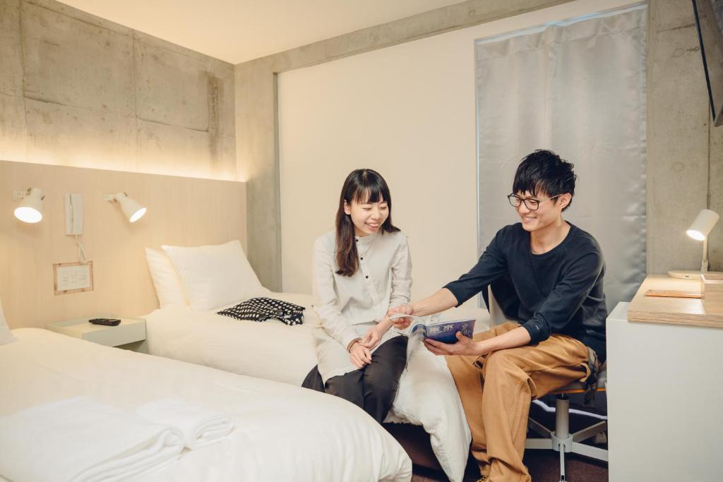 Postel nebo postele na pokoji v ubytování DOMO Hotel