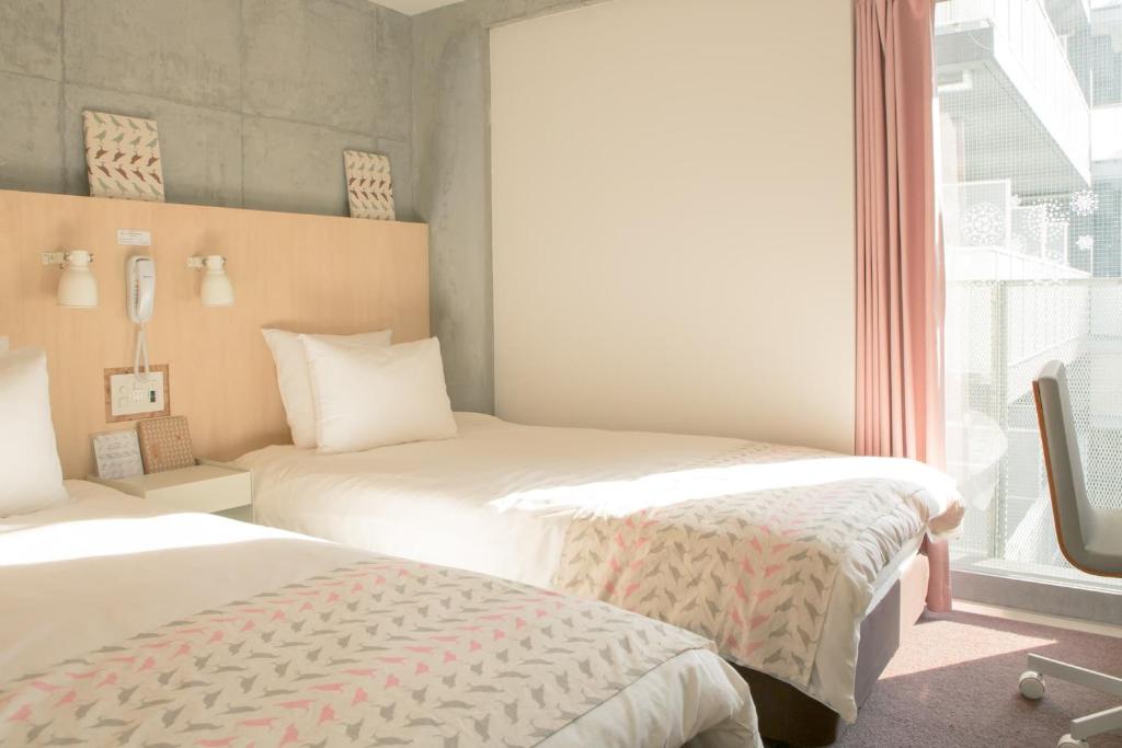 Postel nebo postele na pokoji v ubytování DOMO Hotel