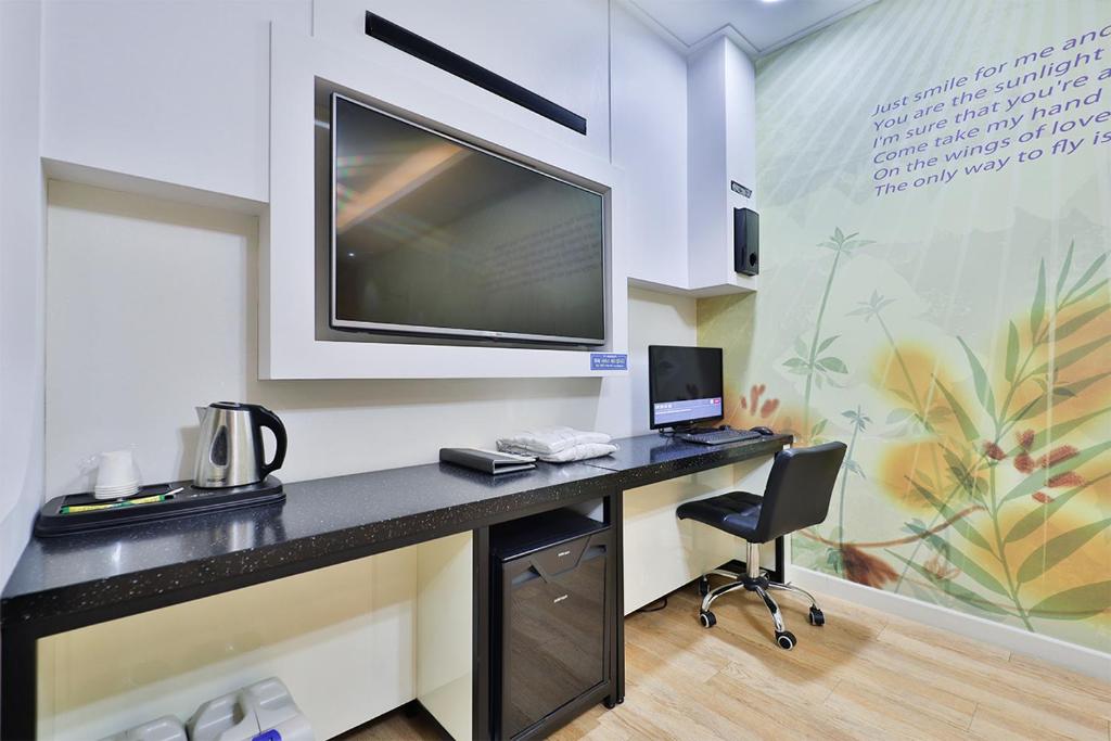 Kuchyň nebo kuchyňský kout v ubytování G&G Hotel