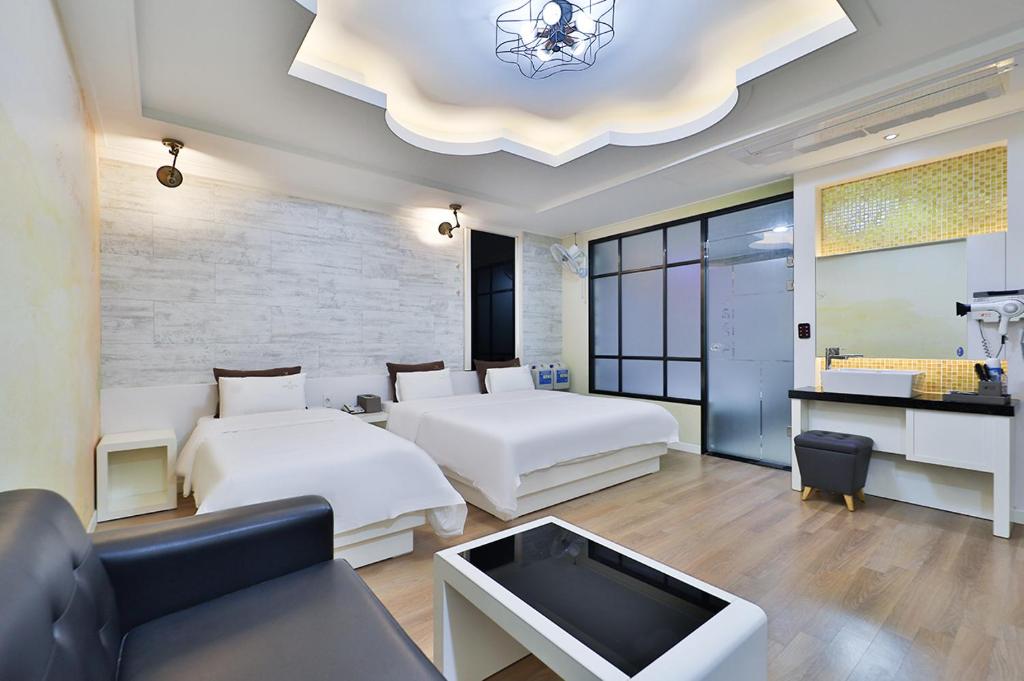 Postel nebo postele na pokoji v ubytování G&G Hotel