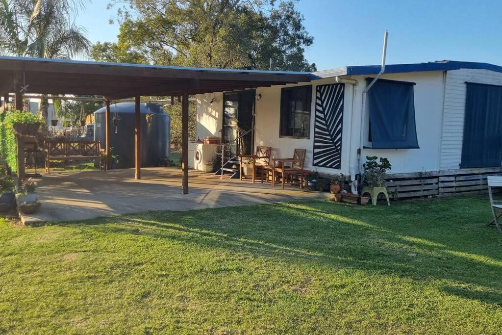 a mobile home with a deck and a patio at Pillar to Coast in Pillar Valley