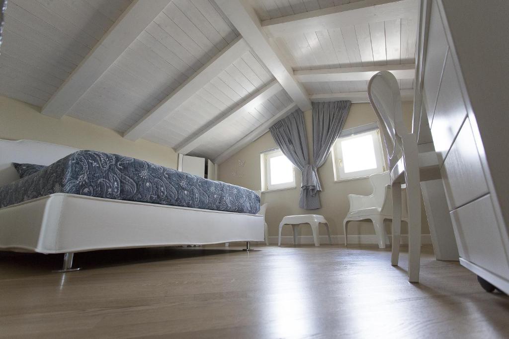 Postel nebo postele na pokoji v ubytování Residenza dei Suoni