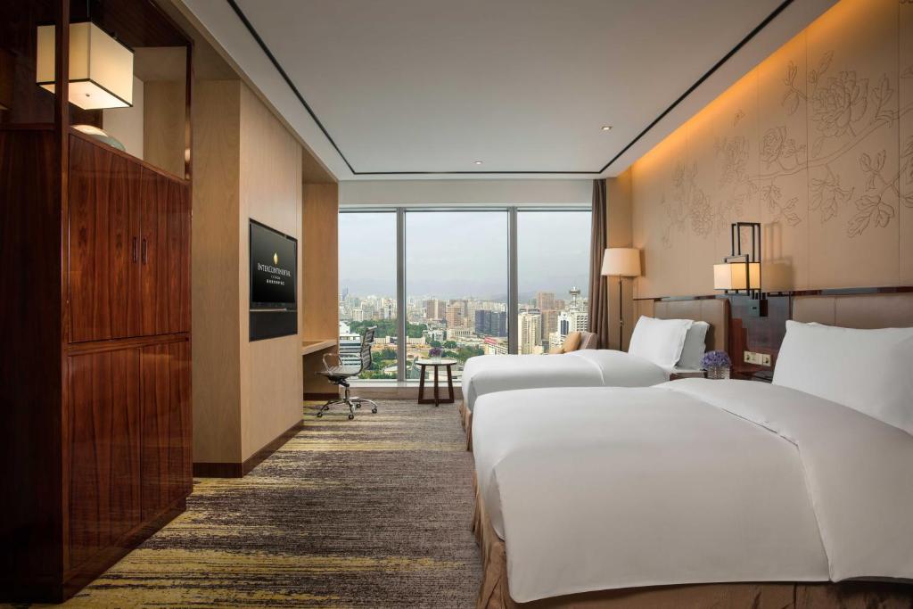 Postel nebo postele na pokoji v ubytování InterContinental Fuzhou