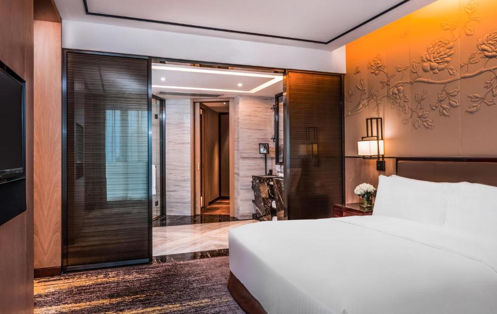 Postel nebo postele na pokoji v ubytování InterContinental Fuzhou