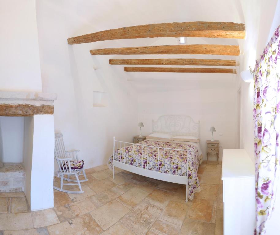 A bed or beds in a room at Masseria Luco