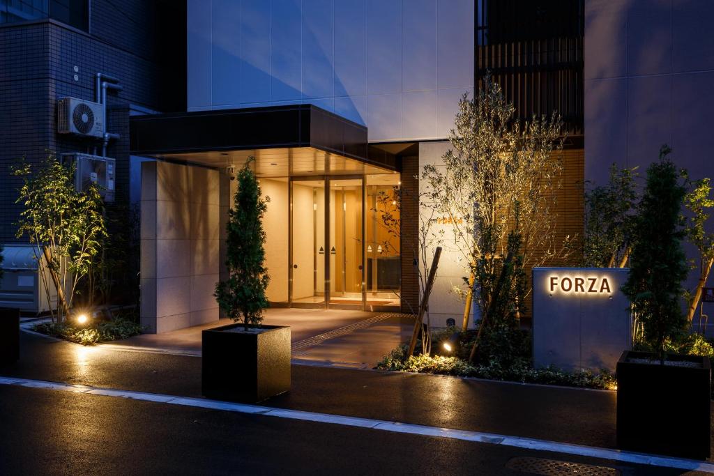 a building with a forza sign in front of it at Hotel Forza Osaka Kitahama in Osaka