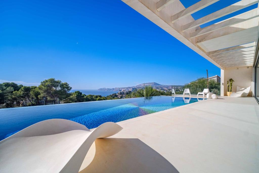 a view of a swimming pool from a villa at Villa Iris Javea by Rock Rentals in Balcon del Mar
