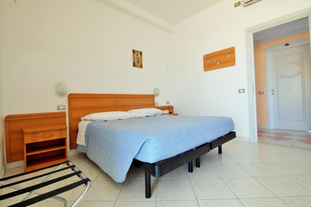 Postel nebo postele na pokoji v ubytování Hotel CasaDei