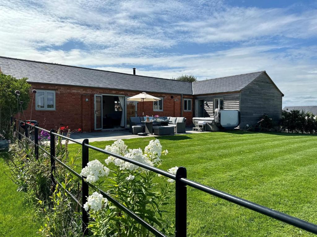 a brick house with a garden and a lawn at 3 Bed in Shaftesbury 87724 in Sedghill