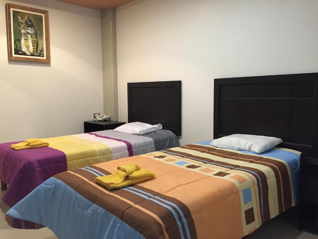 Ένα ή περισσότερα κρεβάτια σε δωμάτιο στο Rolovi Hotel Xalapa Centro