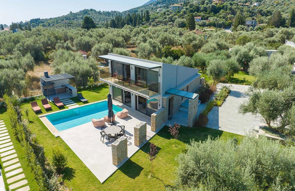 an aerial view of a house with a swimming pool at Torretta - Harmonia in Lygia