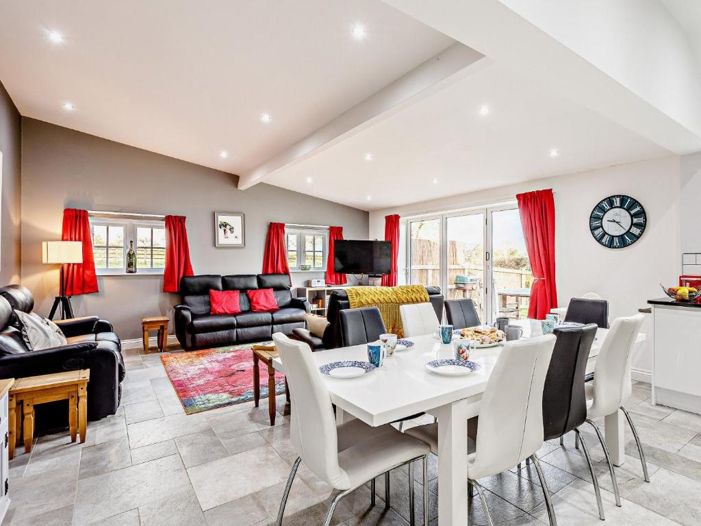 a living room with a table and chairs at 4 Bed in Wedmore 58843 in Theale