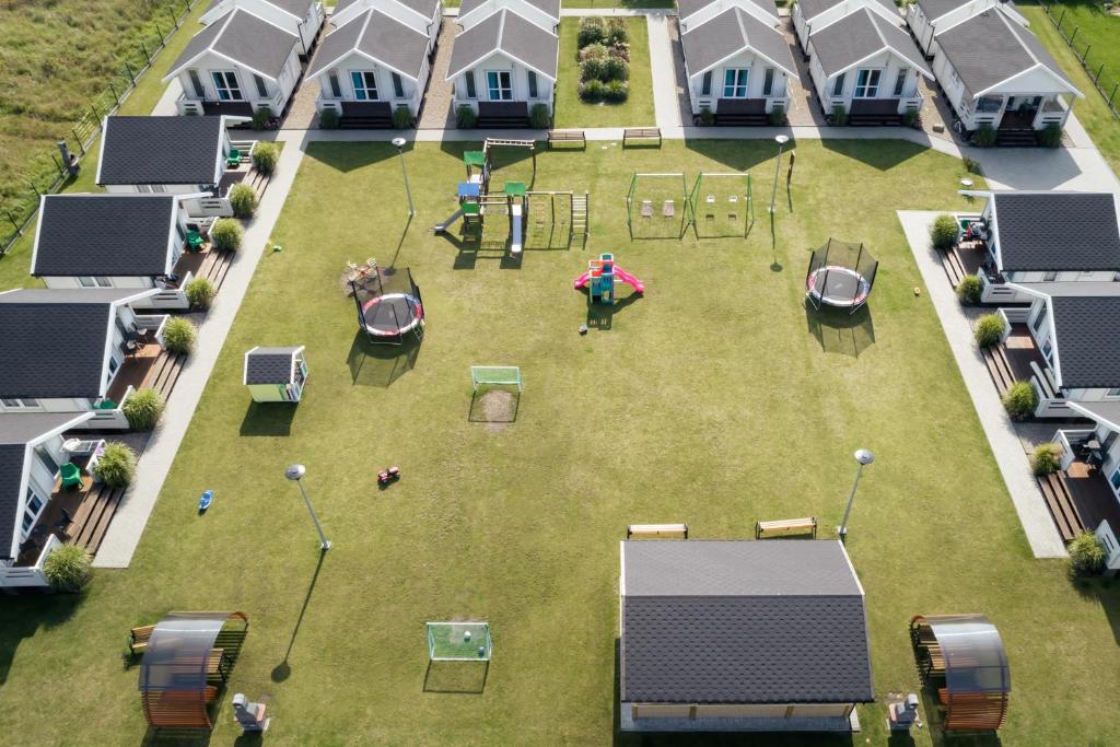 an aerial view of a backyard with a playground at Biała Wioska 2 in Ustronie Morskie