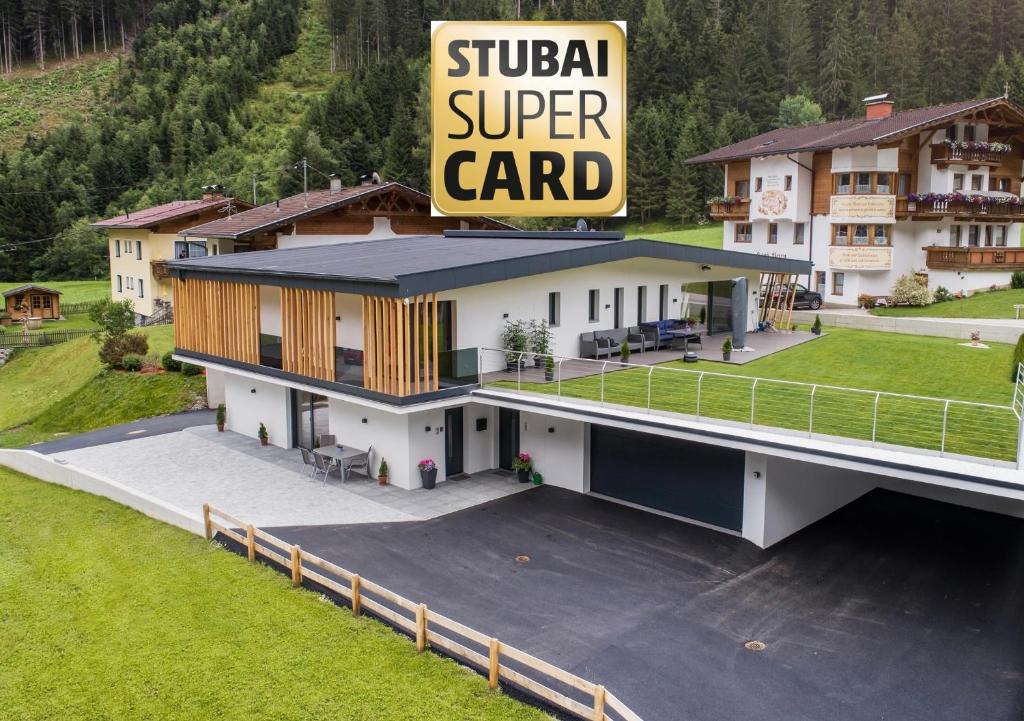 a house with a sign that reads suka super card at Apartment Jasmin in Neustift im Stubaital