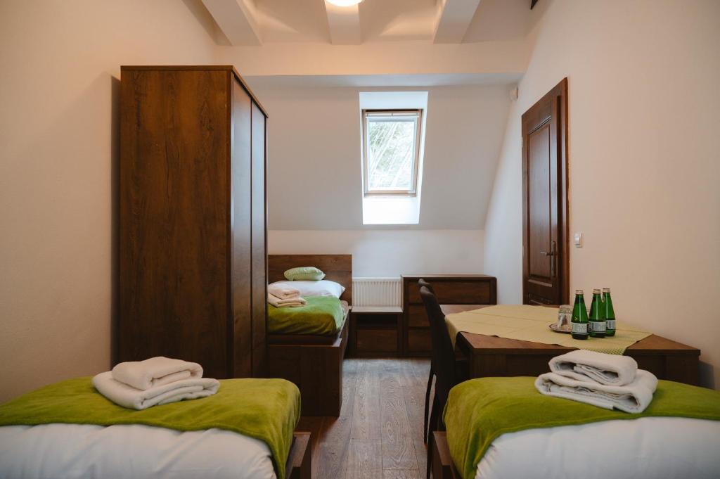 A bed or beds in a room at Majláthova Chata Popradské Pleso