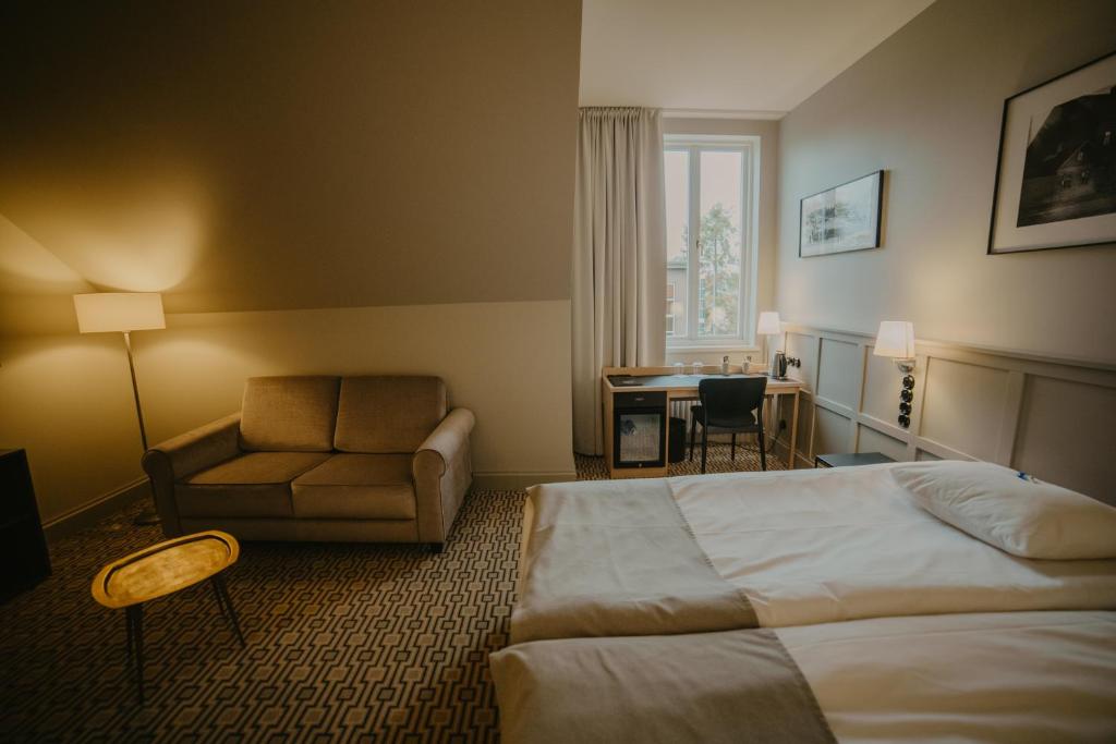 Postel nebo postele na pokoji v ubytování Coop Hotell