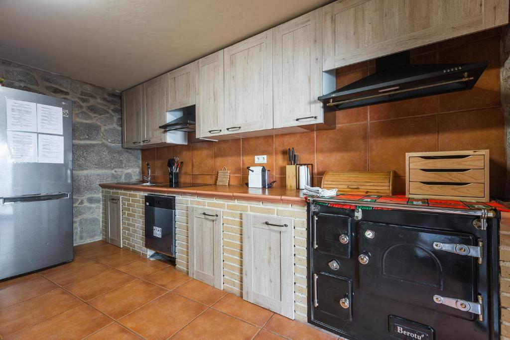 Kuchyň nebo kuchyňský kout v ubytování Villa Vaquiña