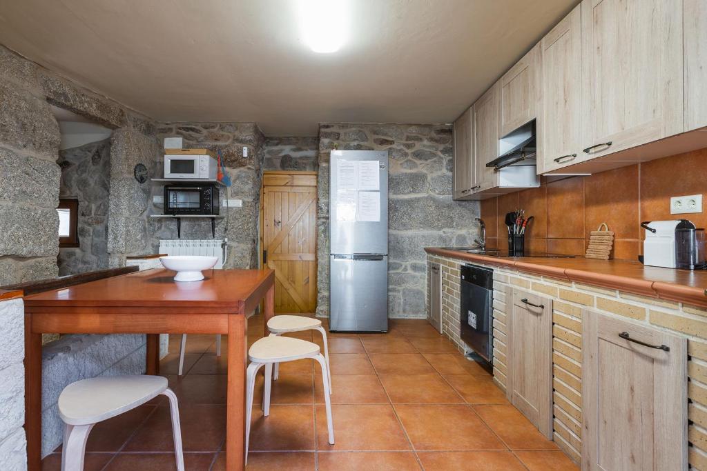 Kuchyň nebo kuchyňský kout v ubytování Villa Vaquiña