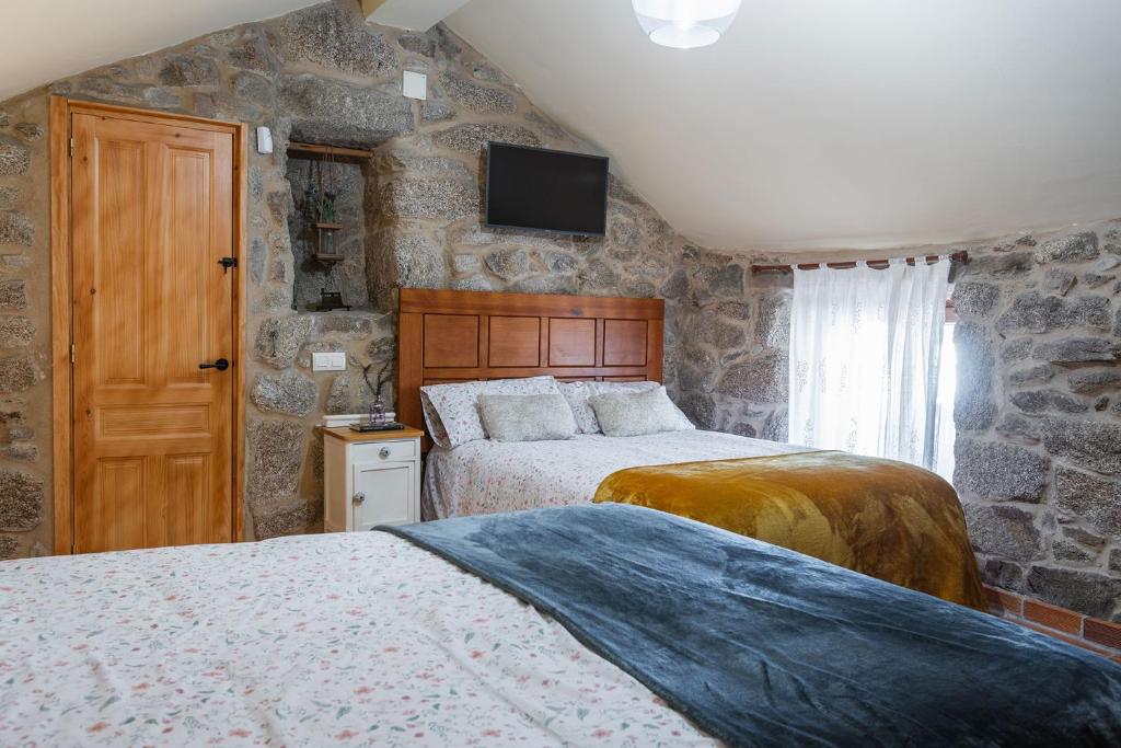 Postel nebo postele na pokoji v ubytování Villa Vaquiña