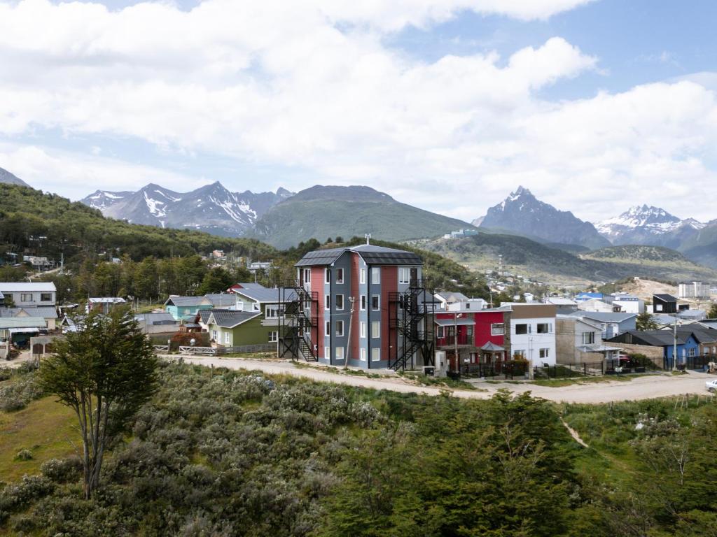 a small town with mountains in the background at Robinson Alojamientos - Edificio Erico Orlando in Ushuaia