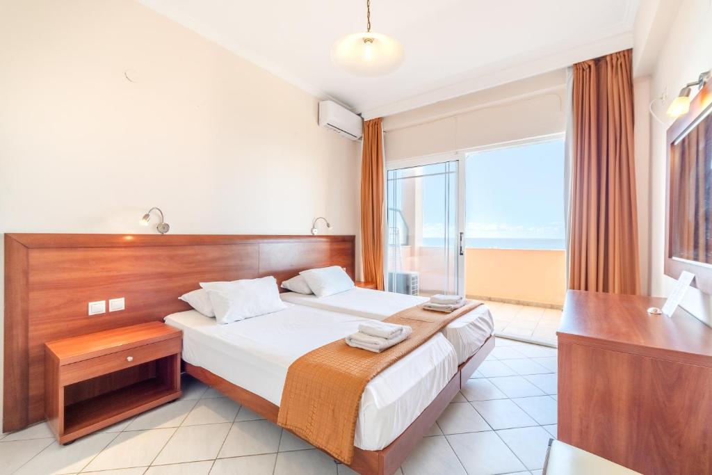 Ein Bett oder Betten in einem Zimmer der Unterkunft Lido Sofia Apartments