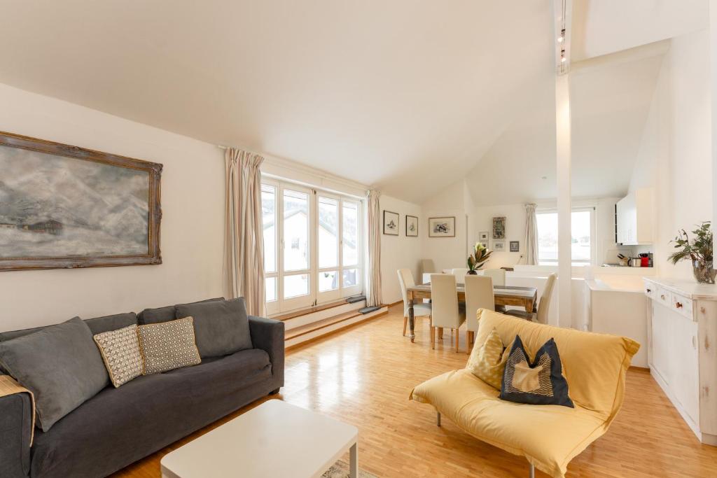 a living room with a couch and a table at Appartmenthaus Centro by Schladming-Appartements in Schladming