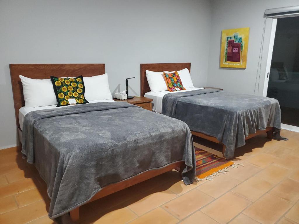 Postel nebo postele na pokoji v ubytování Casa de Tillie