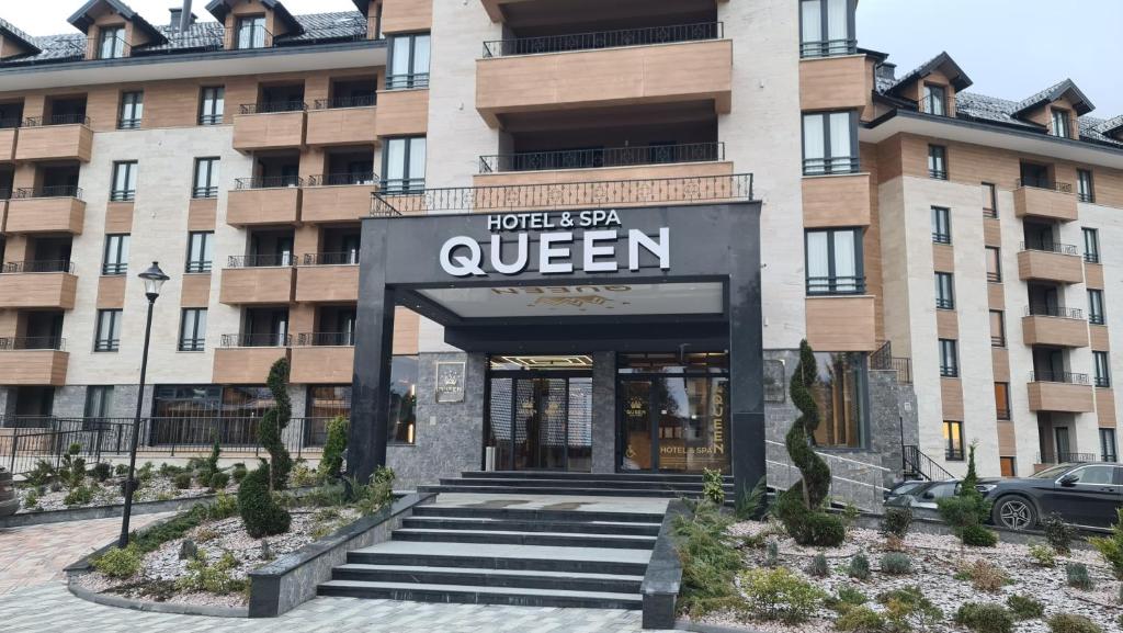 a entrance to a hotel with a sign that reads queen at Sunny Mountain Apartment - Zlatibor, Serbia - SPA & WELLNESS CENTER in Zlatibor