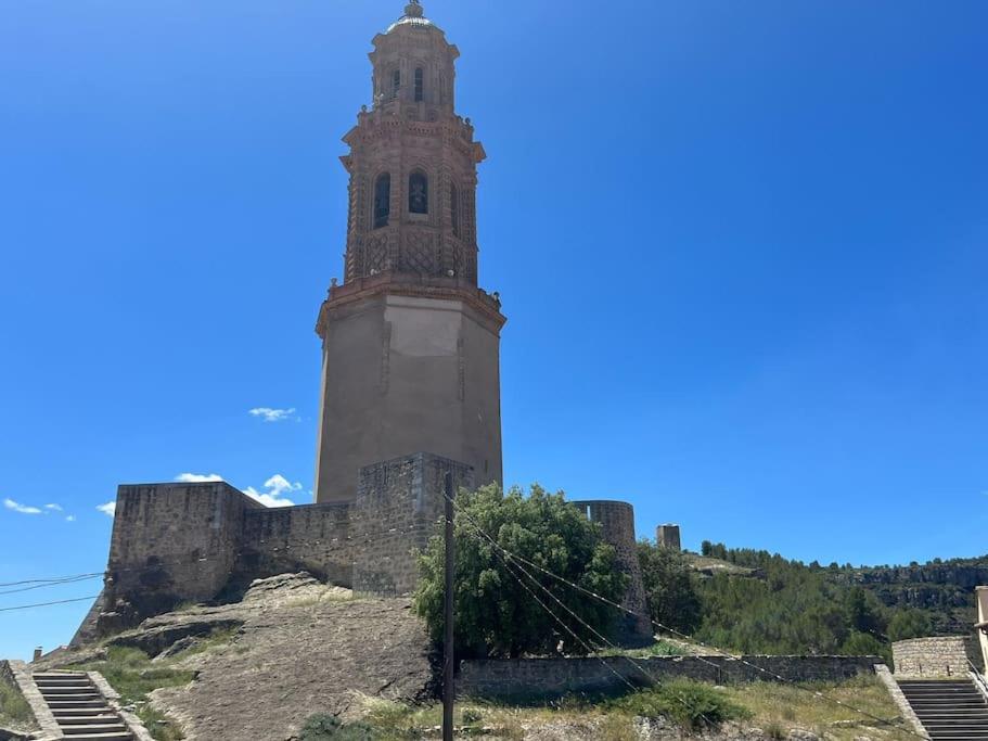 a tall tower on top of a hill at Apto. Rural Cielo. Al lado Torre in Jérica