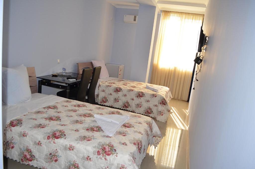 Postel nebo postele na pokoji v ubytování Hotel Okriba