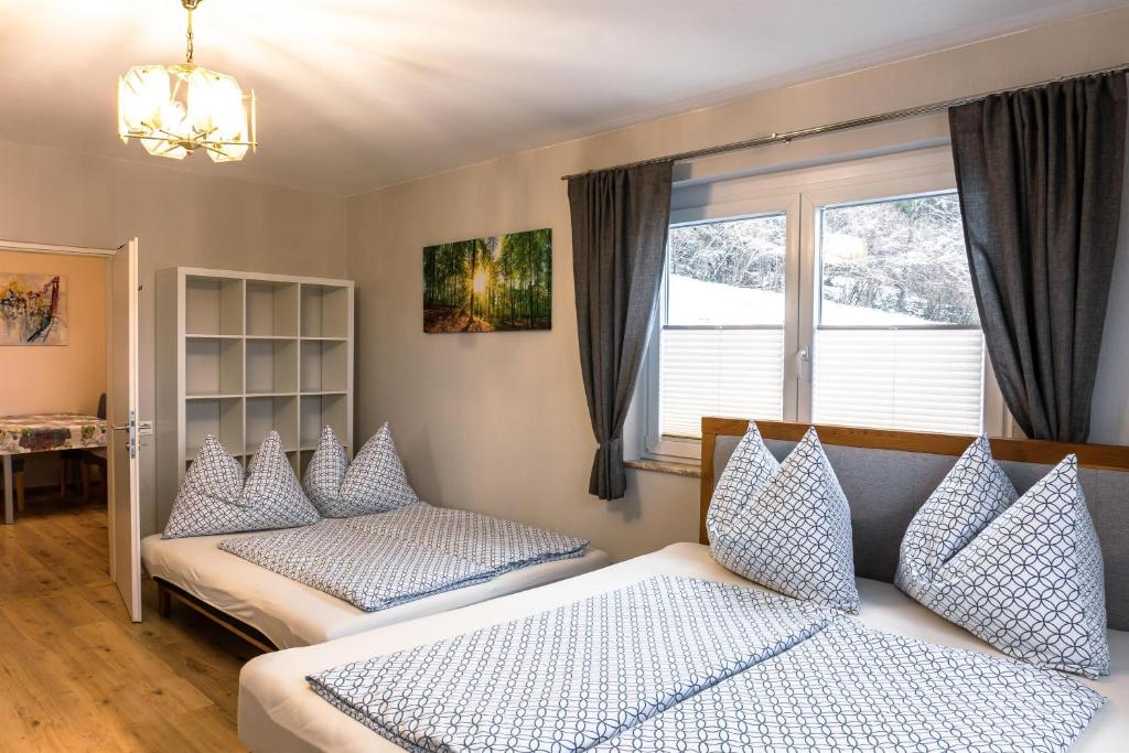 a bedroom with two beds and a window at Real Top 1 in Keutschach am See